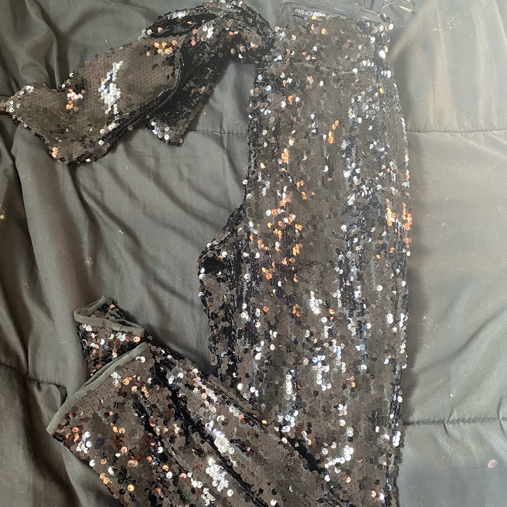 Black sequin pants has some stretch with zipper